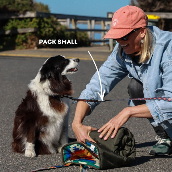 Wet Dog and Co Travel Dog Mat rolled up with carry handle — compact and lightweight at 0.8kg for easy packing